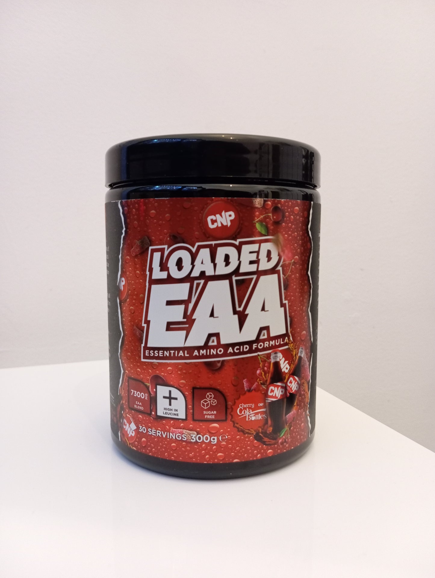 Container of Loaded EAA supplement on a white background